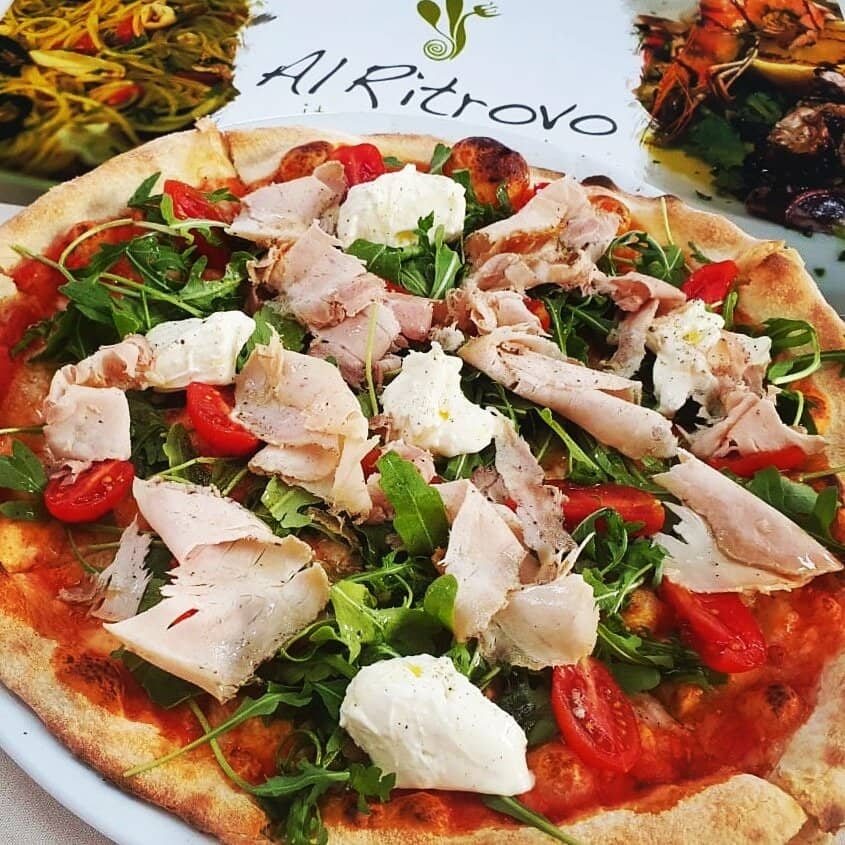 Pizza with Porchetta, Stracchino, Rucola, Cherry Tomatoes