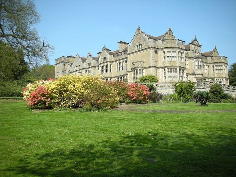 View of Stokesay Court with spring blossoms