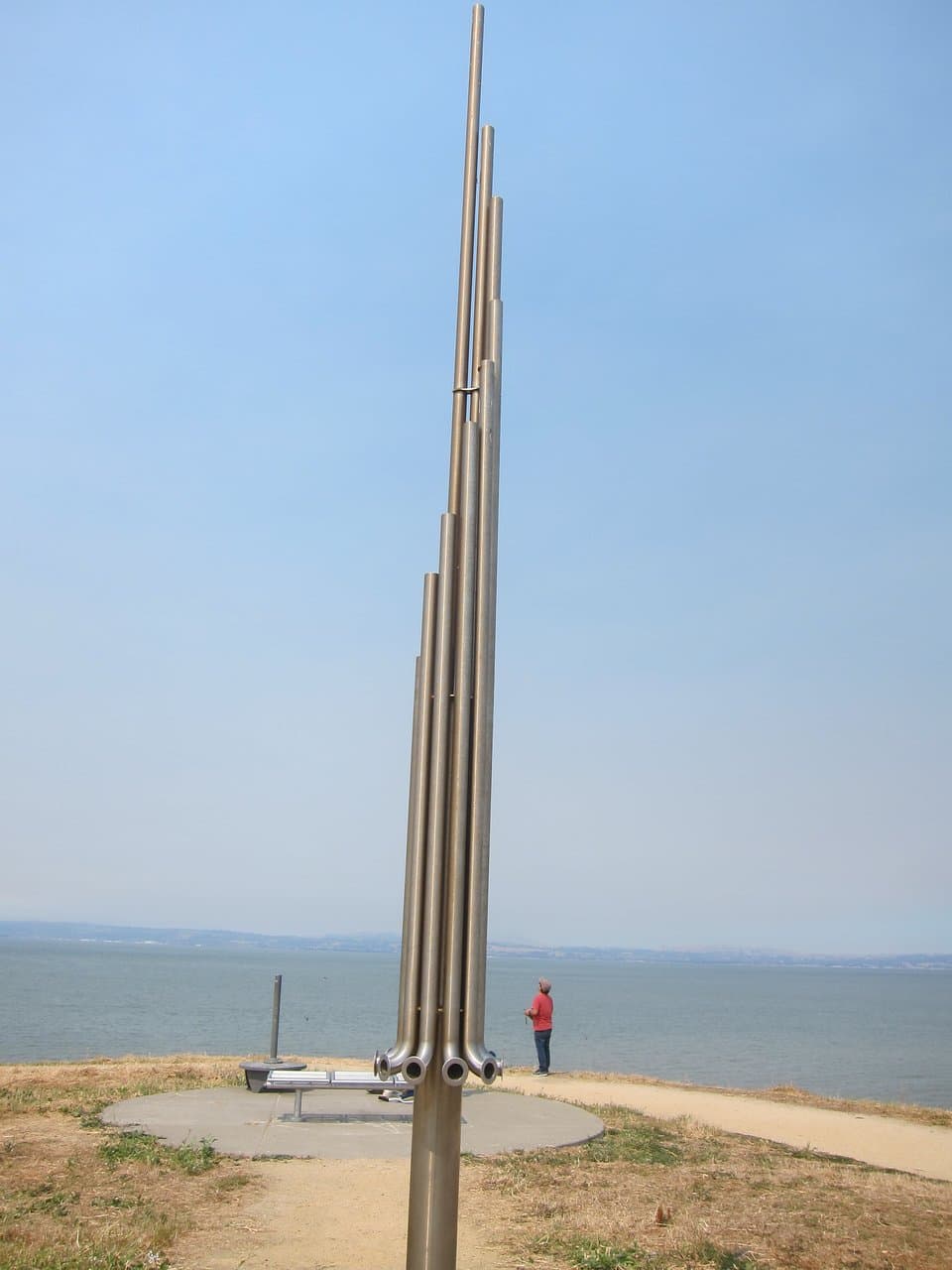 Place your ear against a hole to hear different wind pitches.