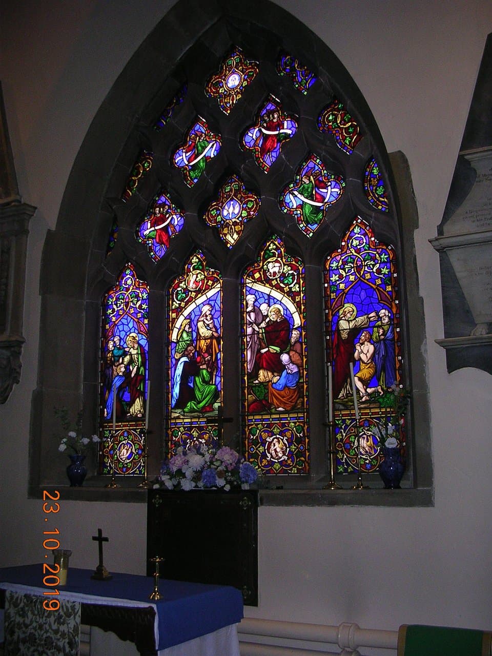 One of the colourful stained-glass windows inside St. Oswald's Church (Oswestry)