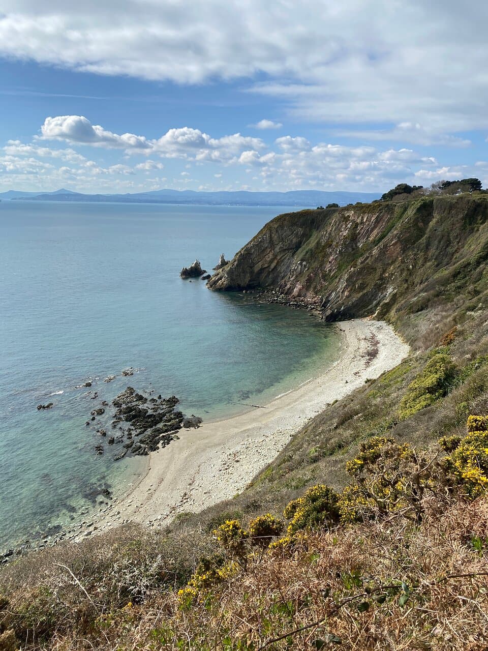 One of many hidden beaches below the cliffs