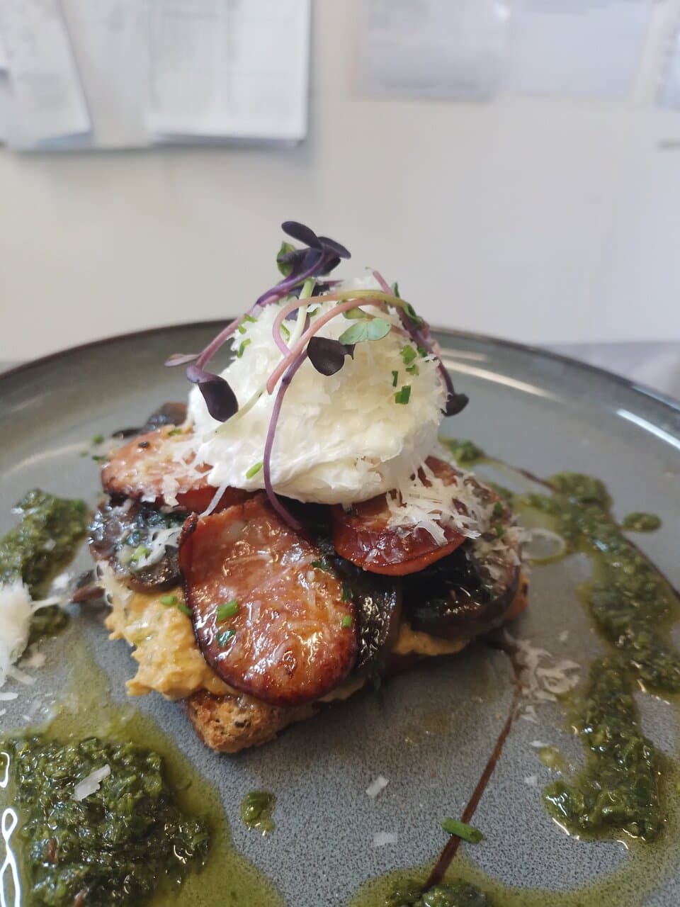 Poached eggs,hummus,chorizo,zhoug