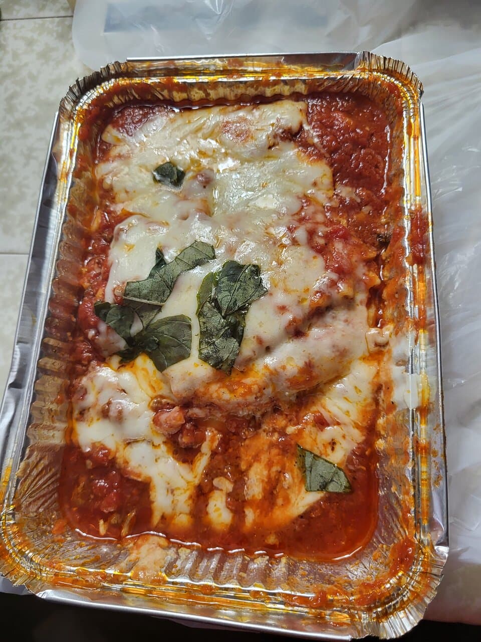 Lasagna with meat sauce $15.20. Not a large serving, about half full.