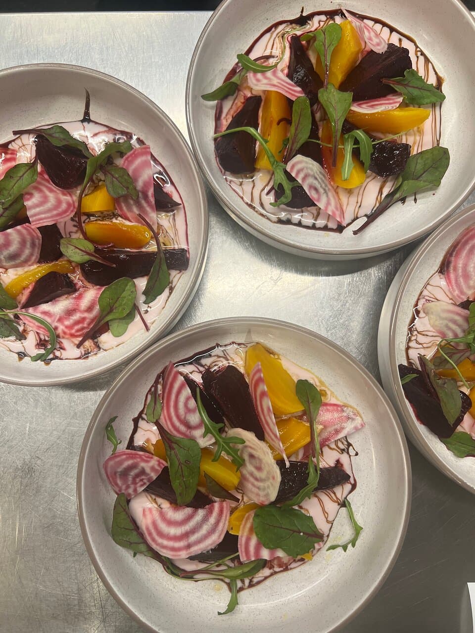 Colourful beetroots, beetroot leaves,tsalafouti cheese,balsamic vinegar. 