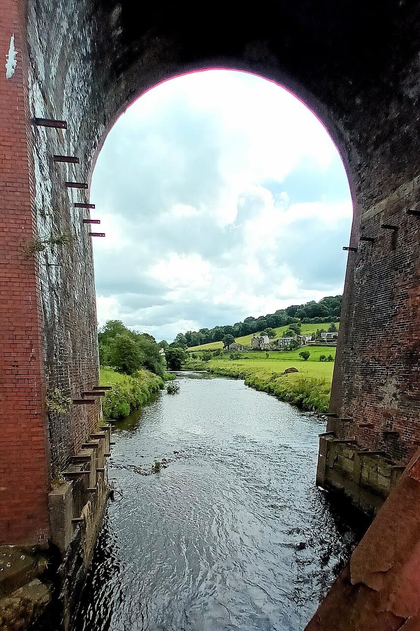 River Calder flows beneath the Whalley Viaduct