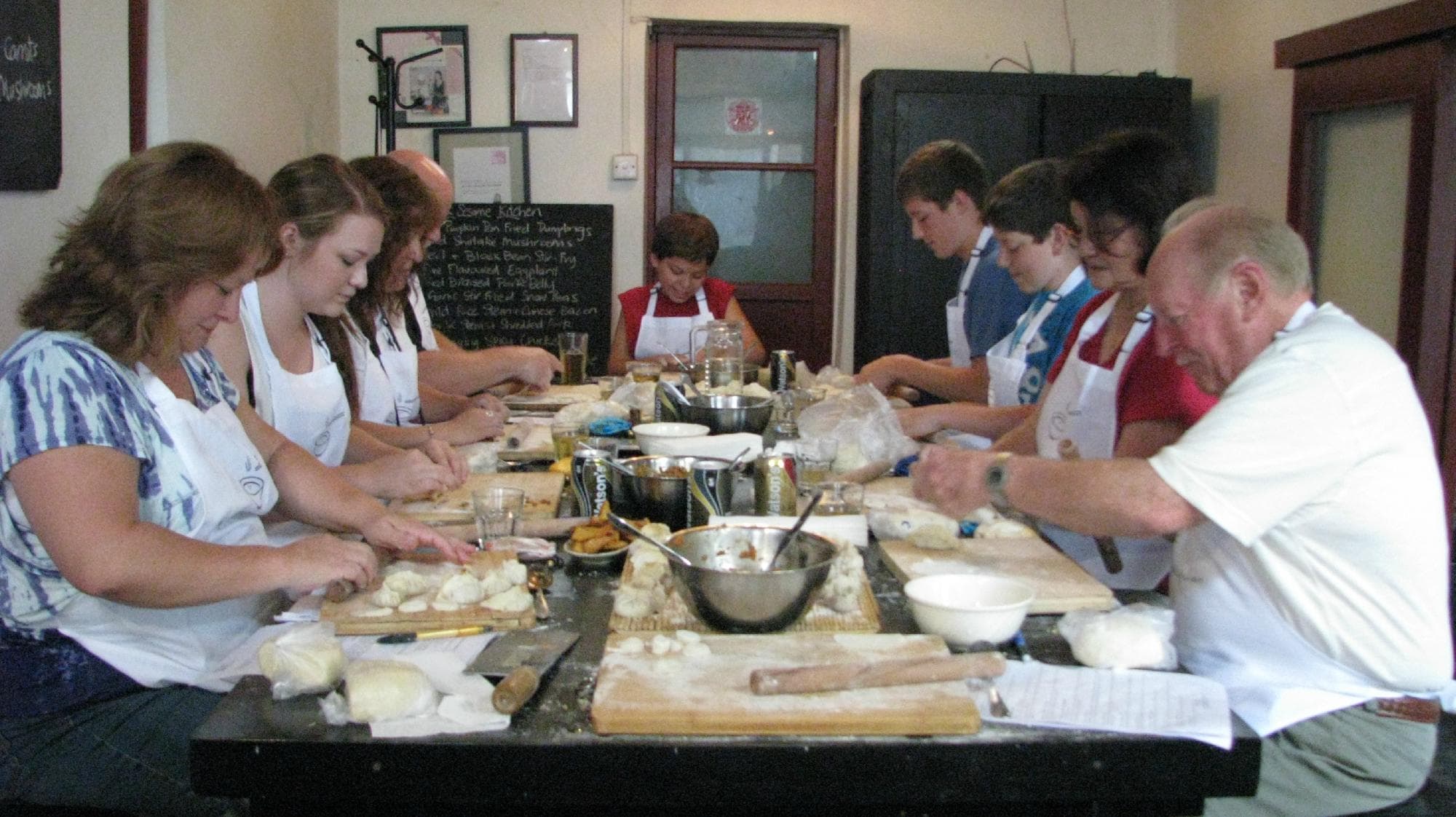Working hard making dozens of delicious dumplings