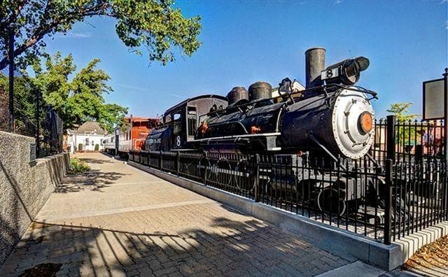 The vintage steam locomotive, cupola caboose and Pullman executive car static train exhibit.