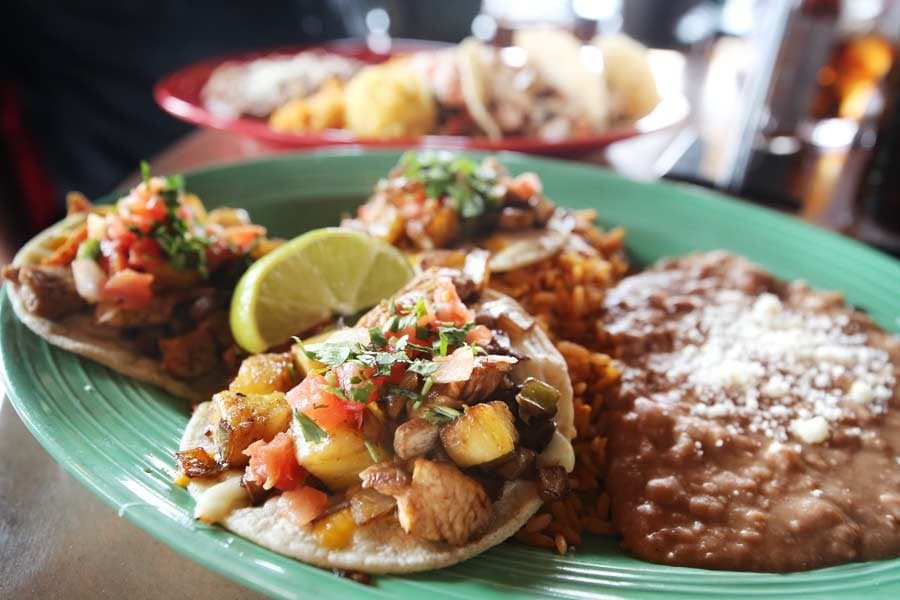 Inspired by the street vendors of Mexico - Que Pasa street tacos are topped with marinated chick