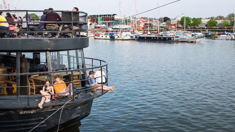 Dangling legs over the water