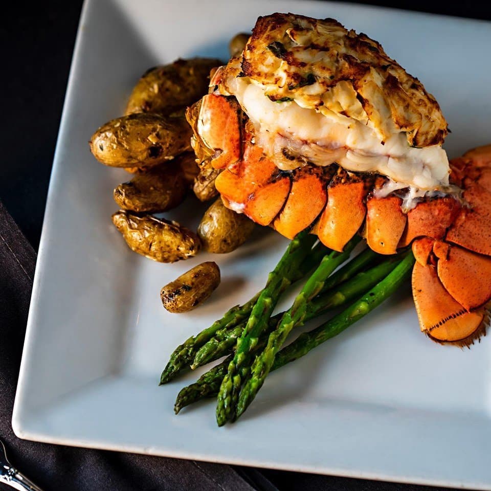 Cold water 6 oz lobster tail topped with jumbo lump crab cakes. Served with a side of asparagus and roasted fingerling potatoes. 