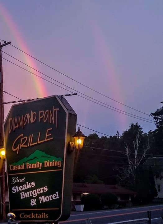 A literal double rainbow led us to a culinary pot of gold tonight. An amazing family meal was had by all at the Diamond Point Grill. This is one of the 3 restaurants we saw on the Food Network's Summer Rush show. The seafood bisque and BBQ salmon was incredible. We arrived to a packed restaurant and after a short wait were seated at the only available table. Our waiter Chris was fast and attentive anticipating our every need with polished professionalism. It was a flawless epicurean experience!