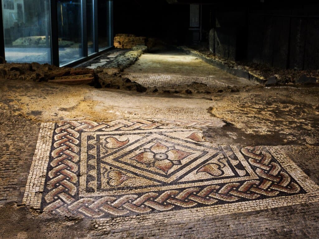 Preserved in-situ Roman mosaic corridor at Canterbury Roman Museum