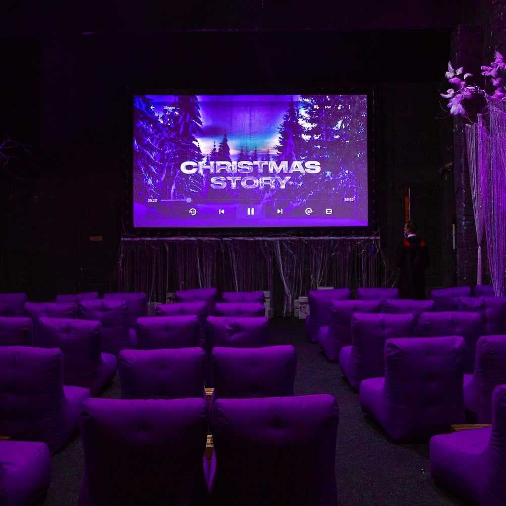 cinema hall with cozy seats and atmospheric decorations