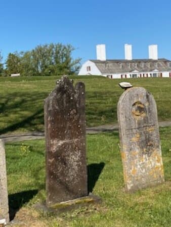 Garrison Cemetery with Fort Anne in the background.