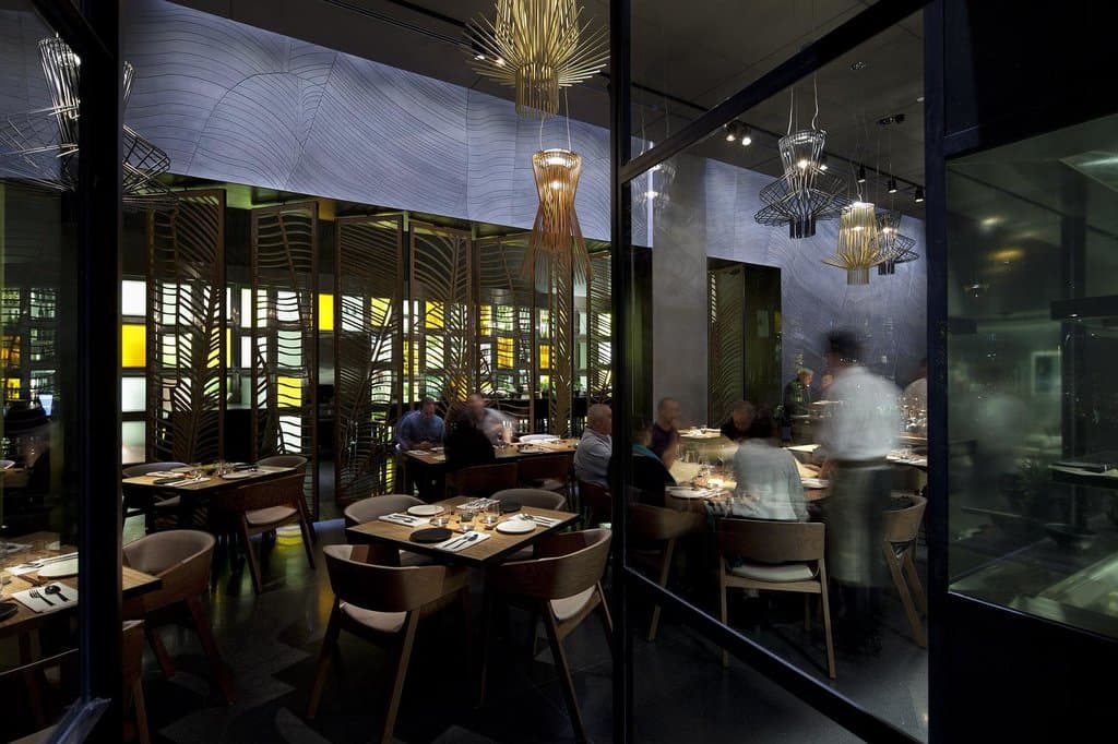 The main dining space is more formal but dynamics of the bar area and open kitchen balance it
