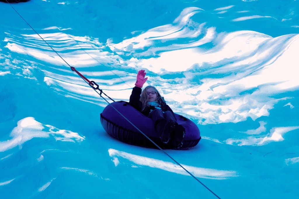 Victoria going up the tow rope at Ski Hill.