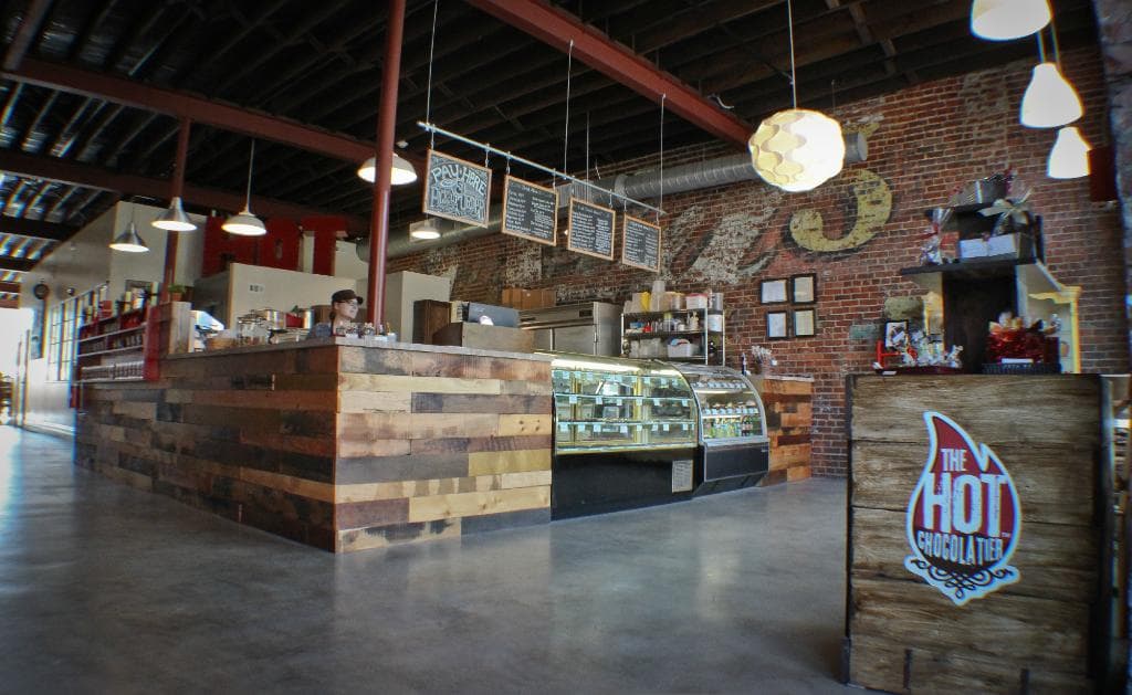 As you enter the shop, you'll see our cases and plenty of smiling faces!