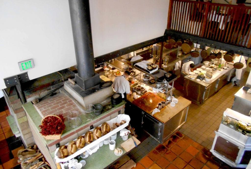 The famous brick oven and chickens awaiting their turn.