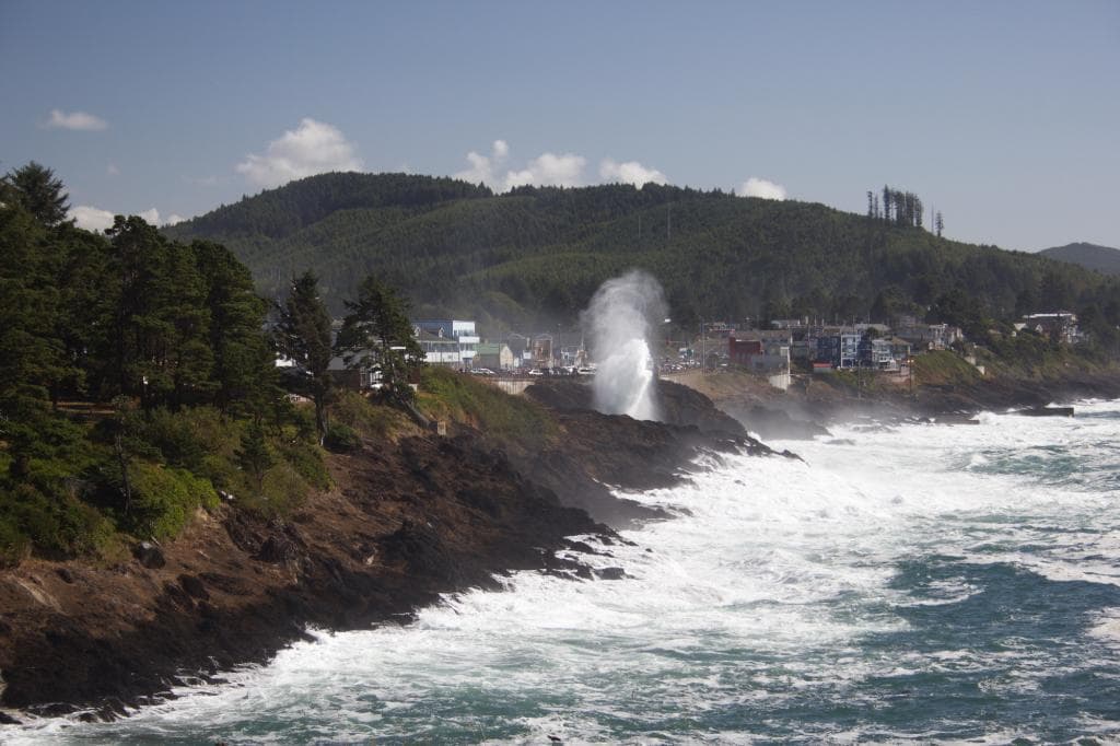 Surf spray over 101 as viewed from Inn at Arch Rock