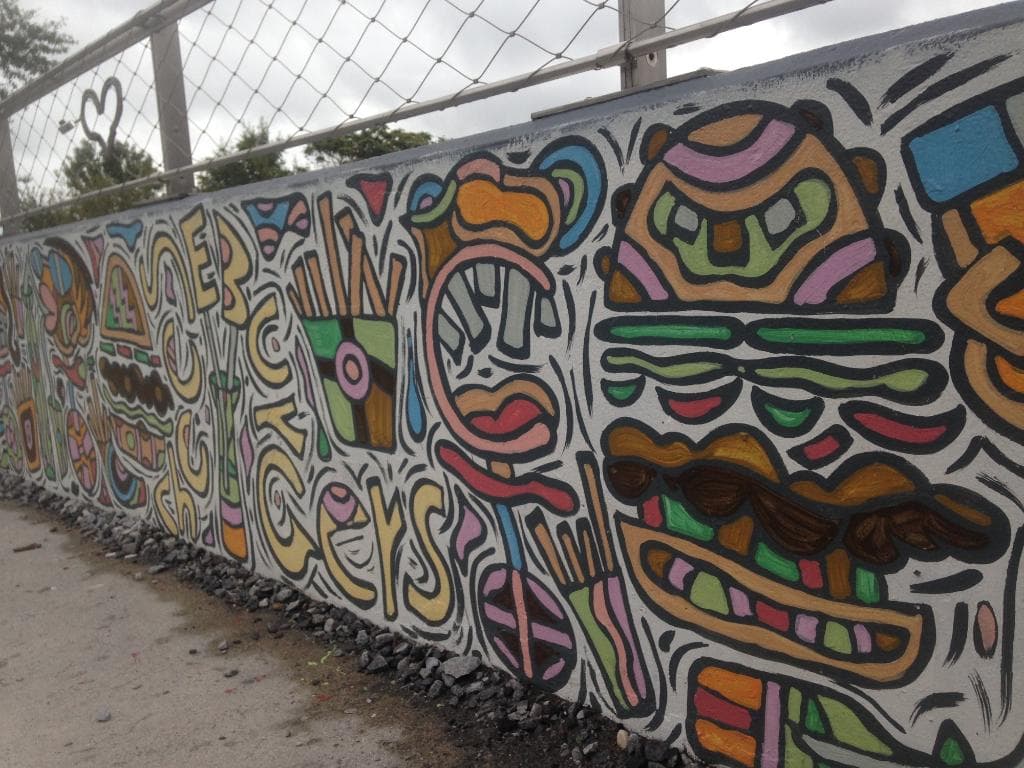 a wall alongside the belt.