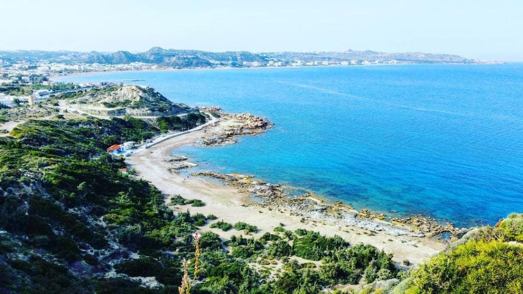 The view of the nudist beach from the hill above.