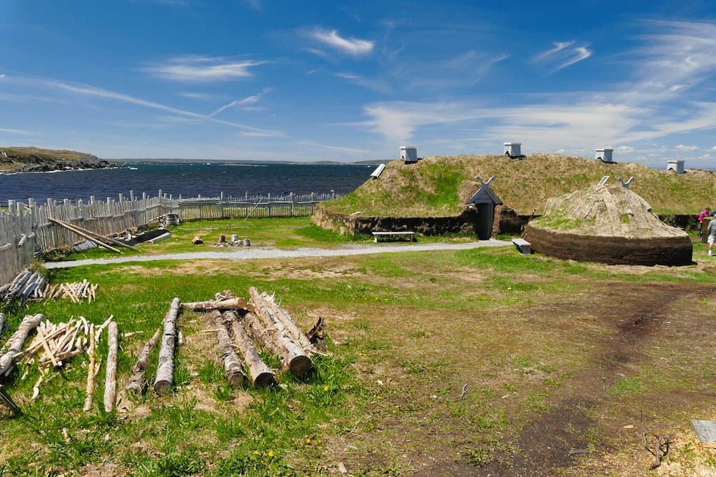 The recreated village, nearby to the actual site which is barely visible.