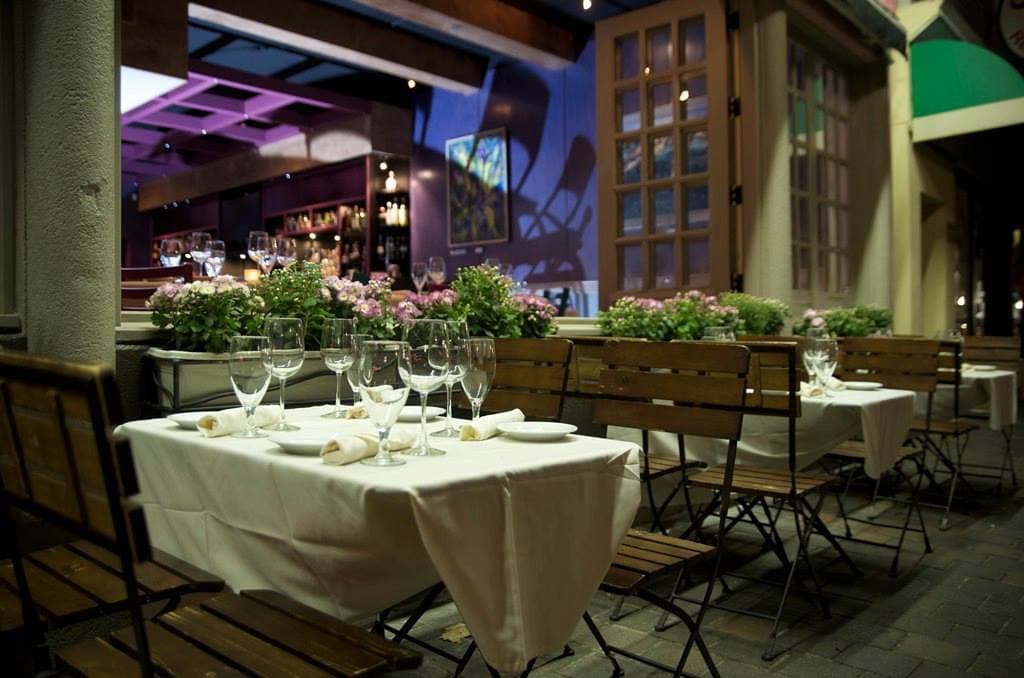 Enjoy al fresco dining on Federal Hill at Trattoria Zooma with complimentary valet parking.