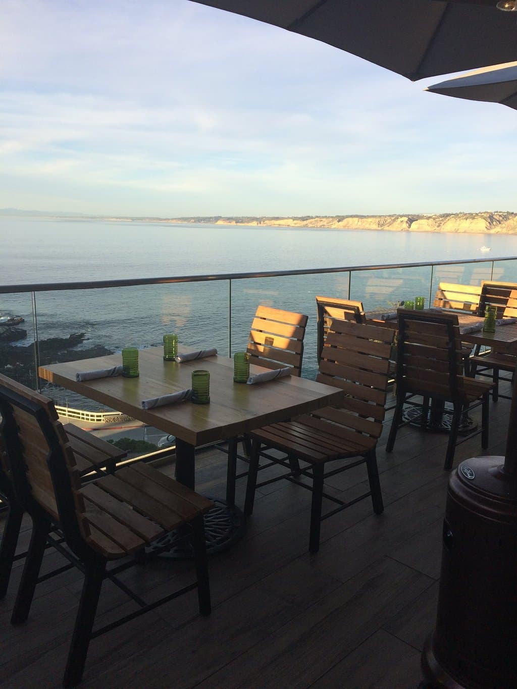 Dinner seating area is alongside the ocean.