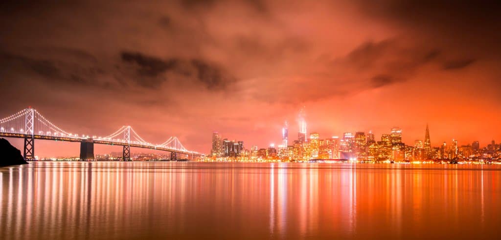 The Bay Bridge and the San Francisco skyline before sunrise