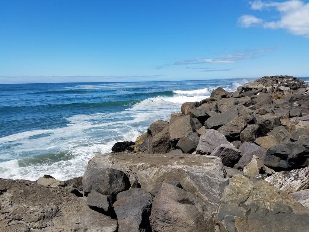 The Pacific gentlely washing up against the South Jetty