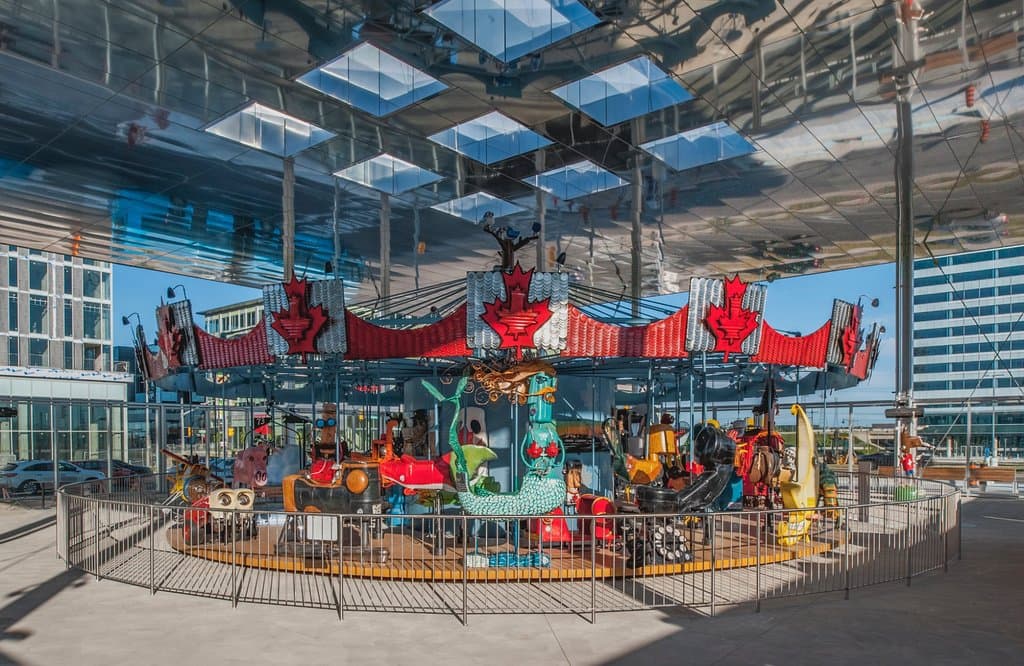 The Pride of Canada Carousel features 44 rideable sculptures made from recycled objects.