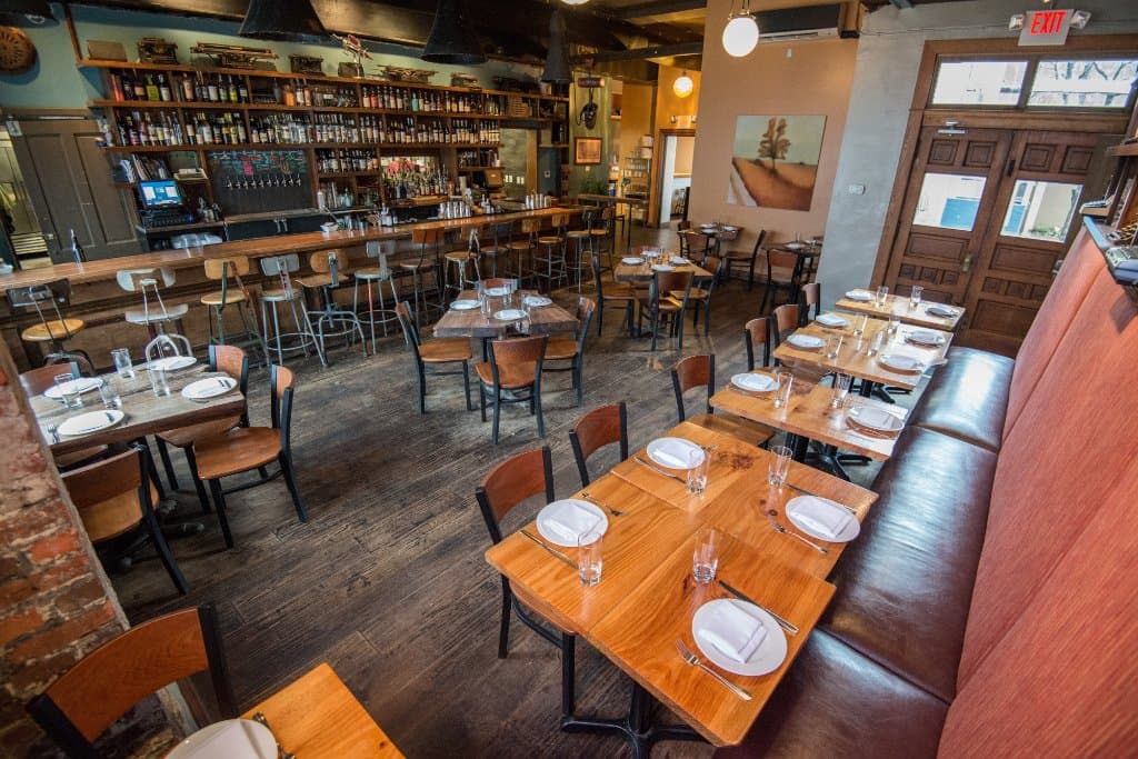 Our bar dining room is filled with reclaimed wood and typewriters.