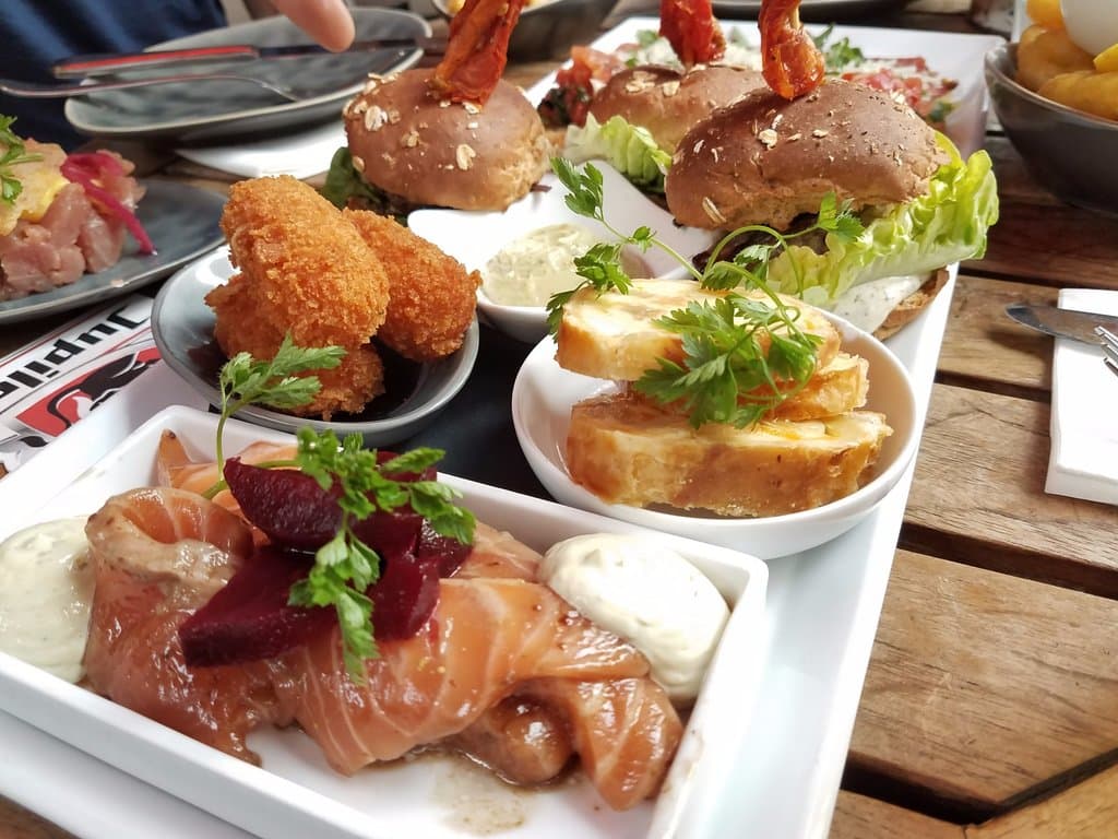 The combination tapas plate I ordered: Marinated salmon, croquettes, goat cheese, and wagyu burg