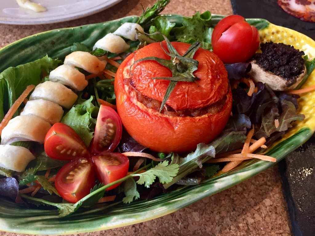 Ham and pastry wrapped asparagus, sausage stuffed tomato and mushroom