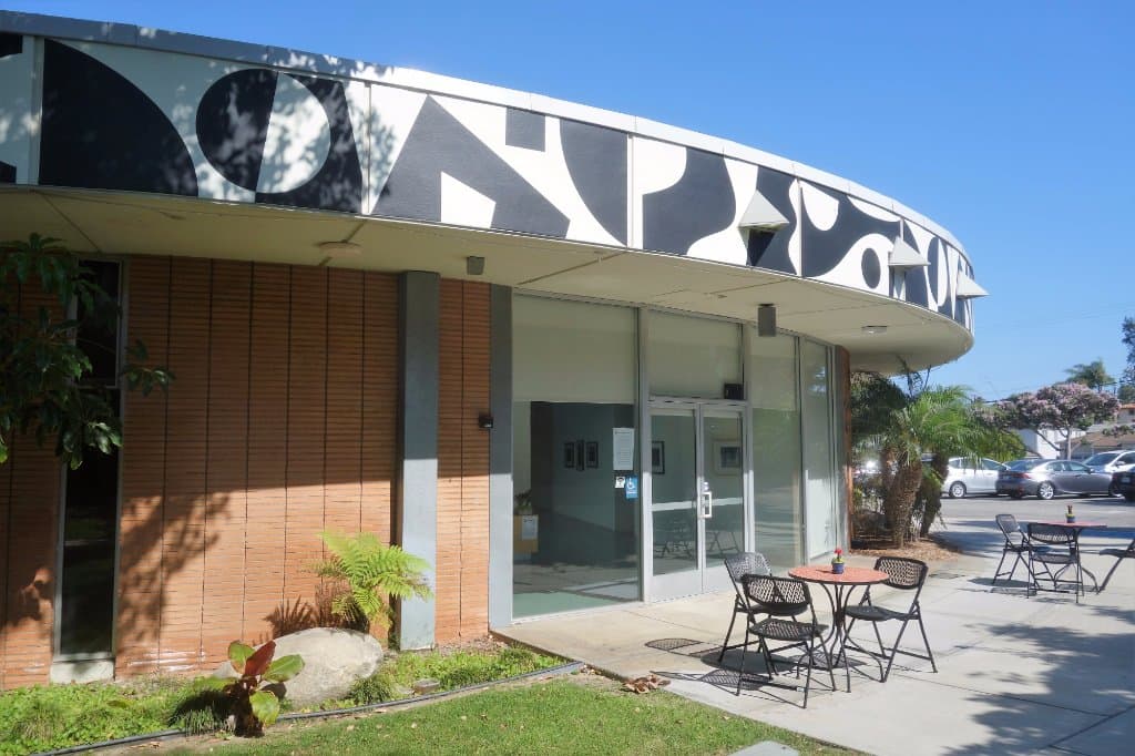 Round Museum Building with tables and chairs on patio