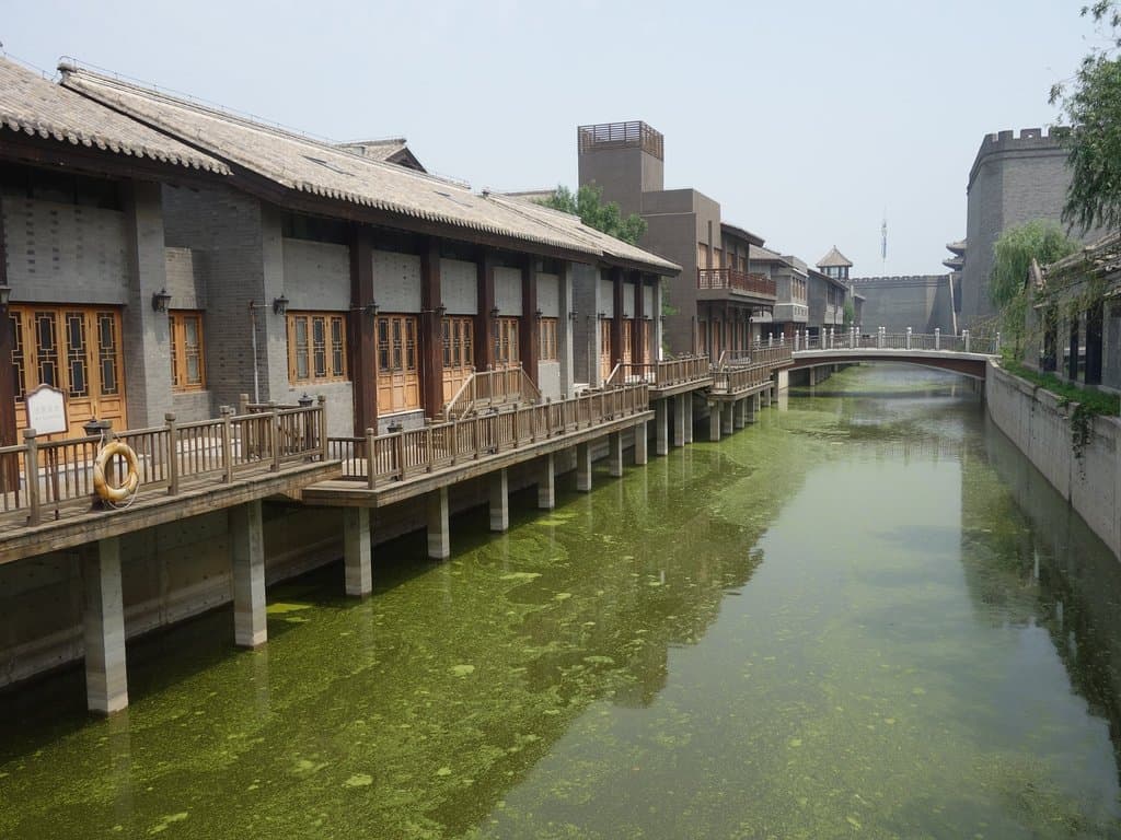 Algae filled moat protecting the empty shops