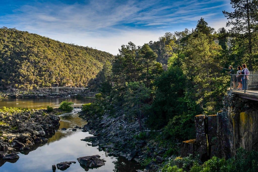 Tour guests take in the spectacular view of First Basin from a fabulous vantage point.