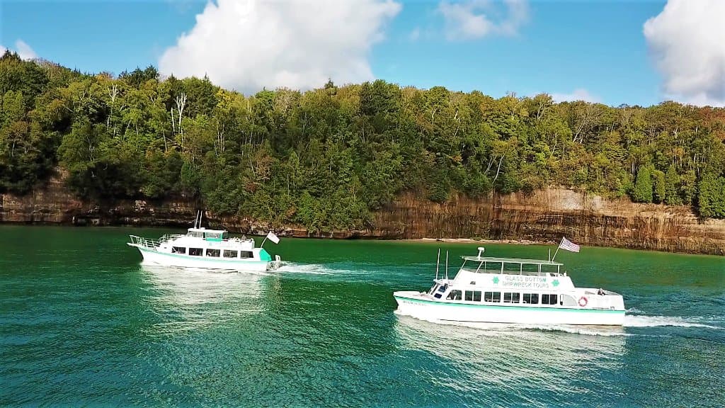 Glass Bottom Boats cruising along the shores of Grand Island
