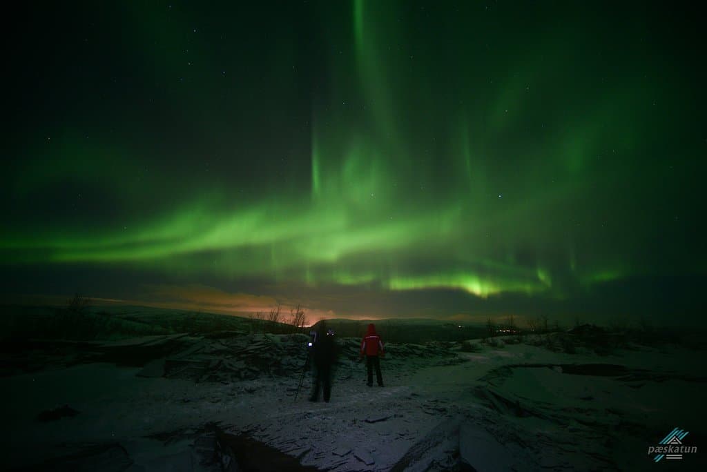 alone in the mountains with the northern lights