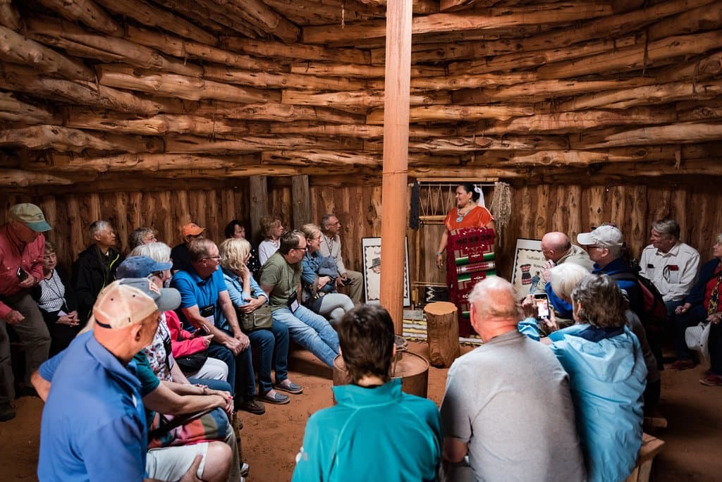 Charlene Hunt giving the weaving demonstration in the Navajo Hogan.