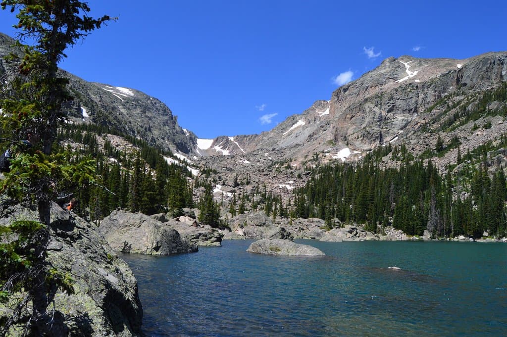 Blue skies above, turquoise water below at Lake Haiyaha