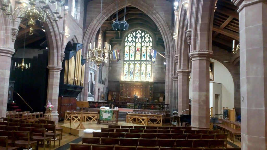 Great view of the Altar with it's huge stained glass window