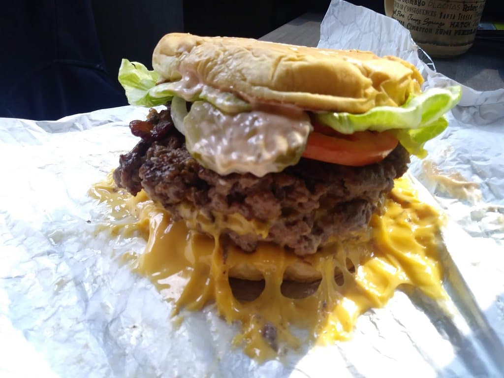 The BEST! Triple Bacon Cheeseburger (1lb) with sriracha Mayo, pickles, onions, tomatoes, lettuce