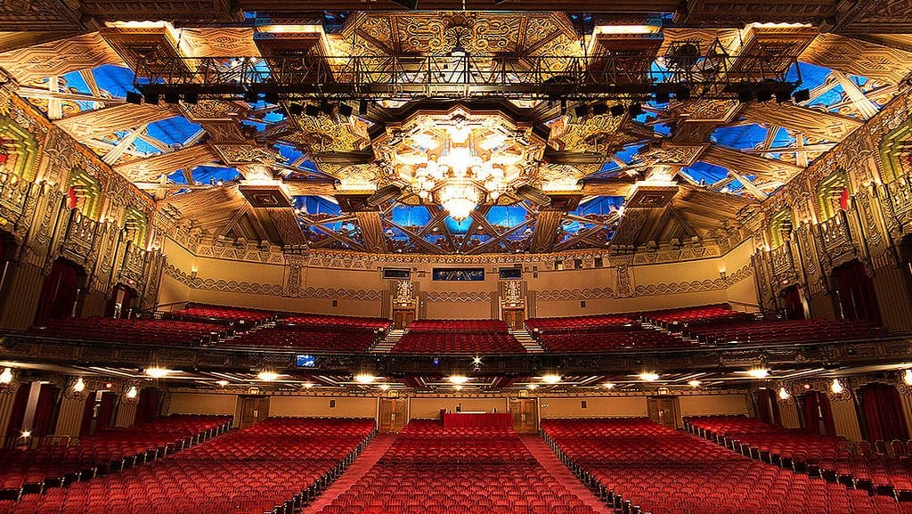 Experience blockbuster musicals in one of L.A.’s most historic and stunning theatres. The seating capacity of the theater is 2,703. Be Advised that there is no elevator in the theatre. If you have seats in the Mezzanine and need assistance locate an usher right away.Concessions takes cash only! At the end of the show you can sometimes catch the cast members exiting the stage door. As you walk out of the seating area take a left and walk to the end of the hallway to exit to the stage door.