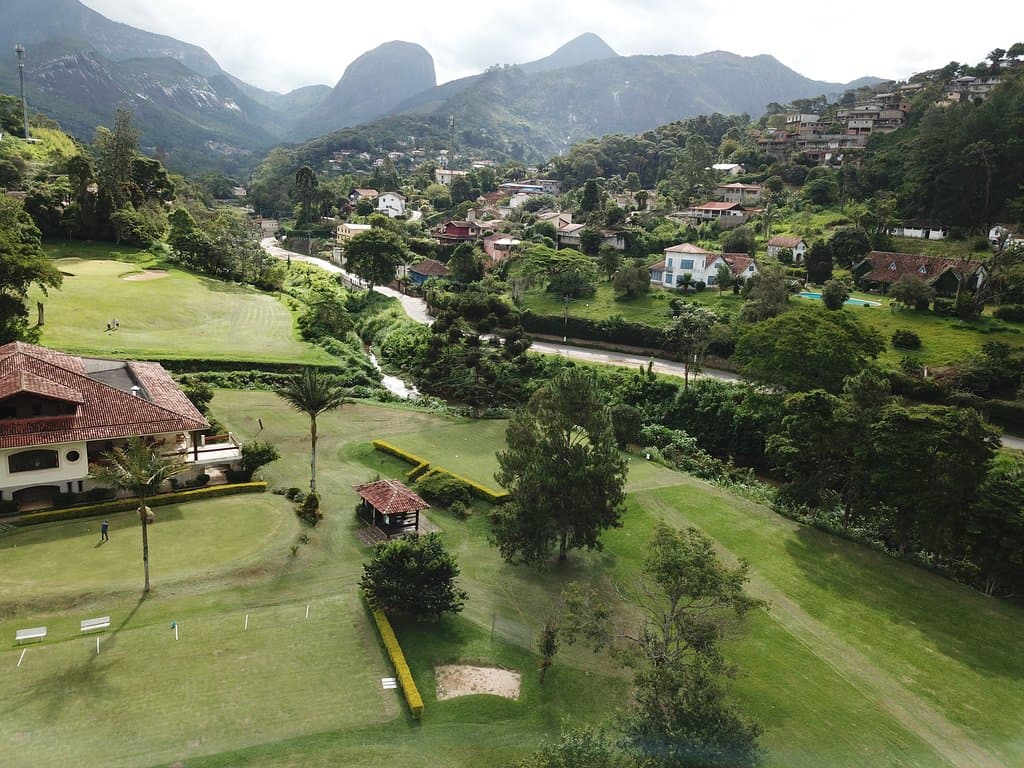part of golf club house, putting green, tee 1 and view towards hole 6.