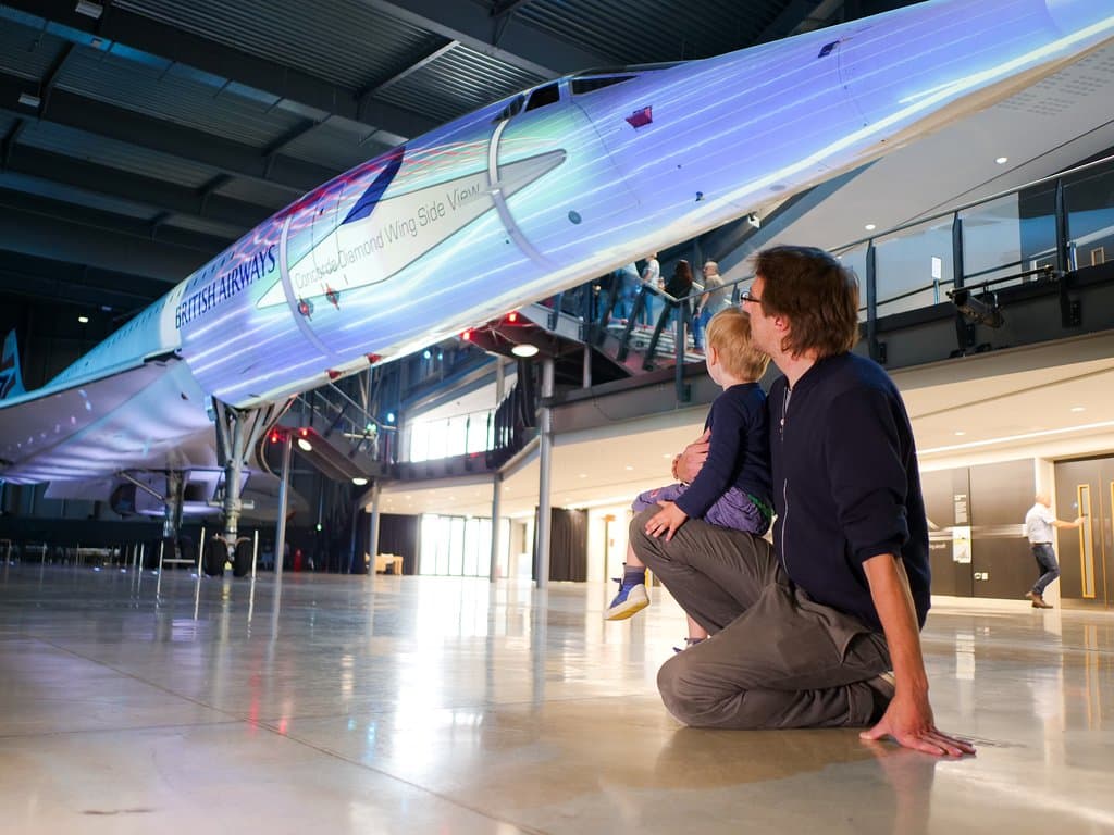 The last Concorde ever to fly, with a projection show playing on the side of the aeroplane