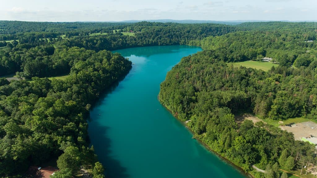 Green Lakes State Park's outstanding features are its two glacial lakes surrounded by upland forest. Both Round and Green Lakes are meromictic lakes, which means that there is no fall and spring mixing of surface and bottom waters. Such lakes have a high potential for evidence of ancient plant and animal life.