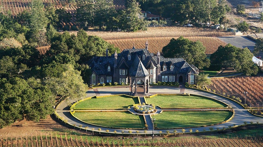 An instant landmark, Ledson Winery, known as “The Castle” around the globe, is an architectural showpiece. The 16,000 square foot French Normandy structure was designed entirely by Steve Ledson and features sweeping staircases, marble fireplaces, cathedral-style windows, coffered ceilings, several tasting bars, and over five miles of ornate wood inlays and mosaics, which were hand-cut and installed by Steve’s son, Mike.