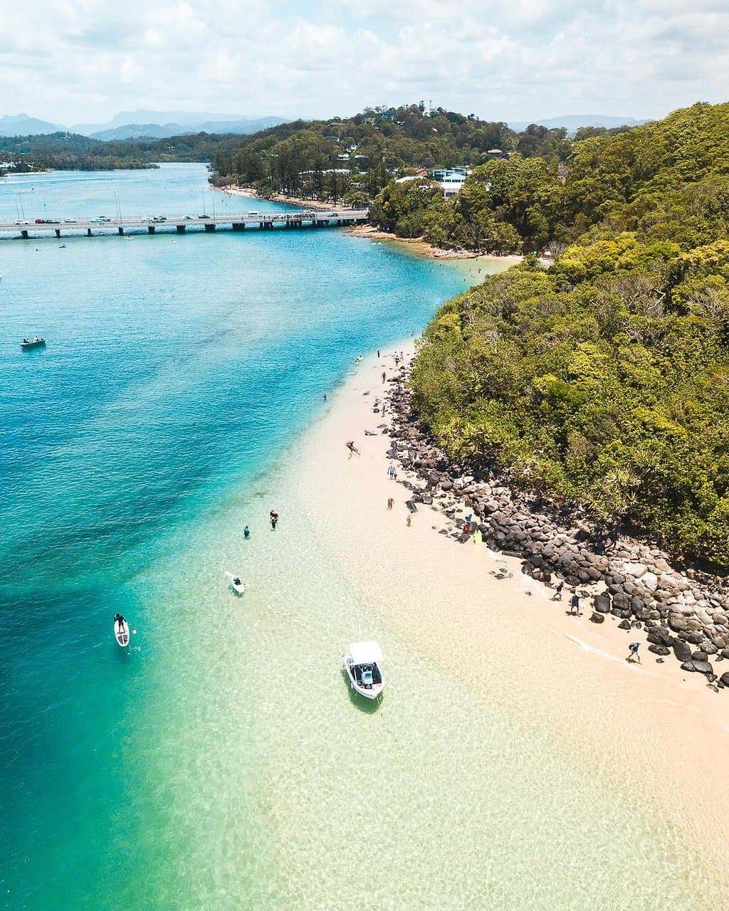 Why would you ever want to leave Tallebudgera Creek with a view like this (every person who has ever visited this spot, has said)? 👌 Summing up three of a local's fave things to do, pull up the boat 🚤 on the sandbank, stand up paddle or simply swim in the piercing blue waters that frame the iconic, nearby Burleigh Headland. 🏊 #WeAreGoldCoast 📸 IG/nathanprostamo