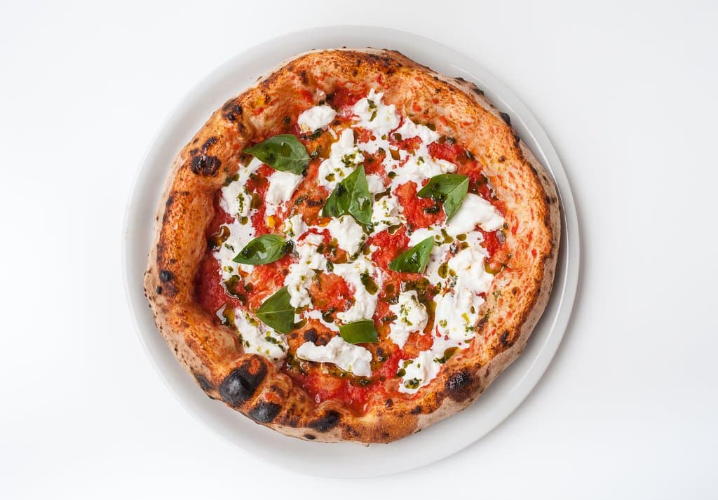 Margherrata (v)
San Marzano tomato, stracciata di bufala (produced locally), basil oil